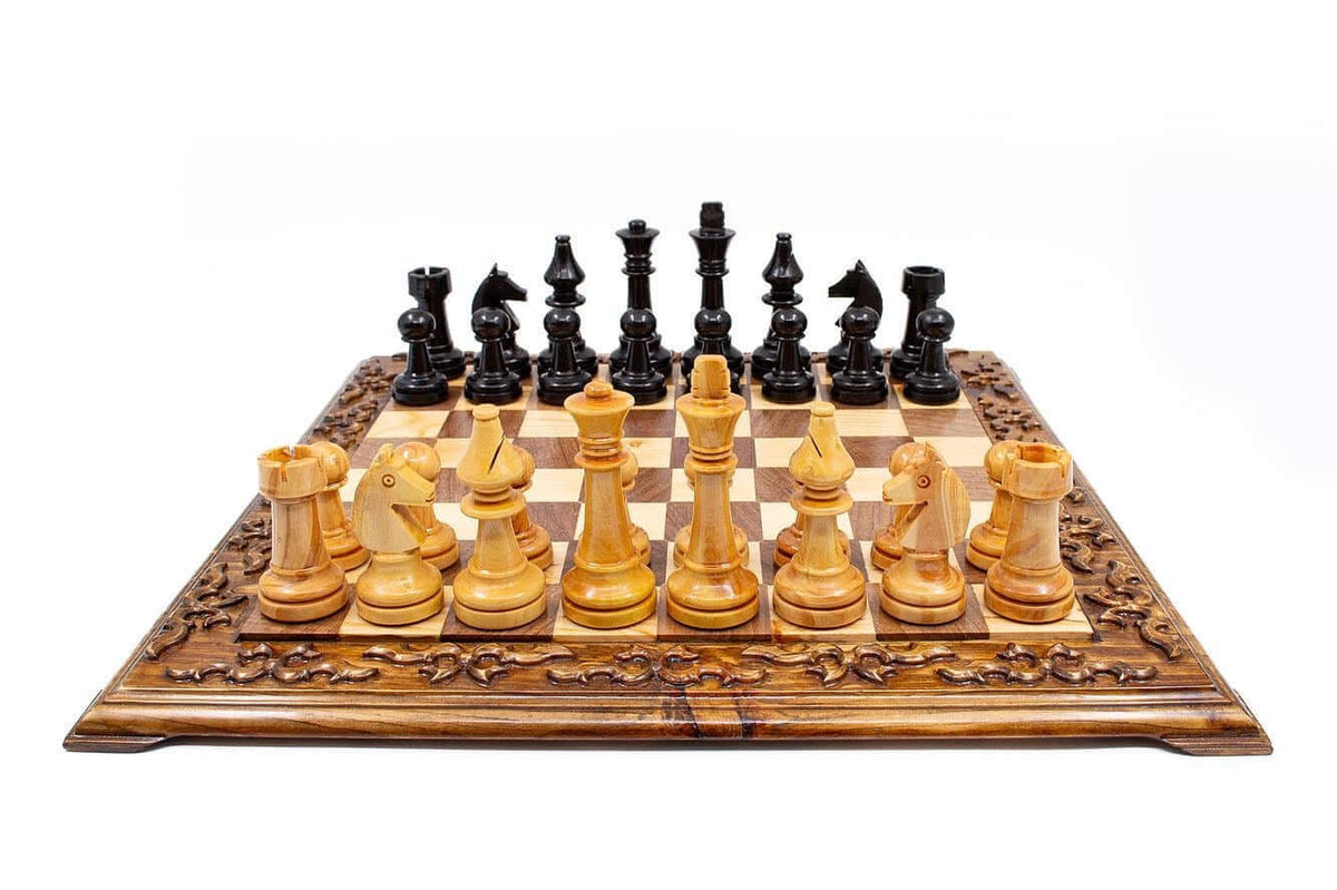 Hand carved wooden chess set with unique Staunton pieces on a decorative board, perfect for collectors and enthusiasts.