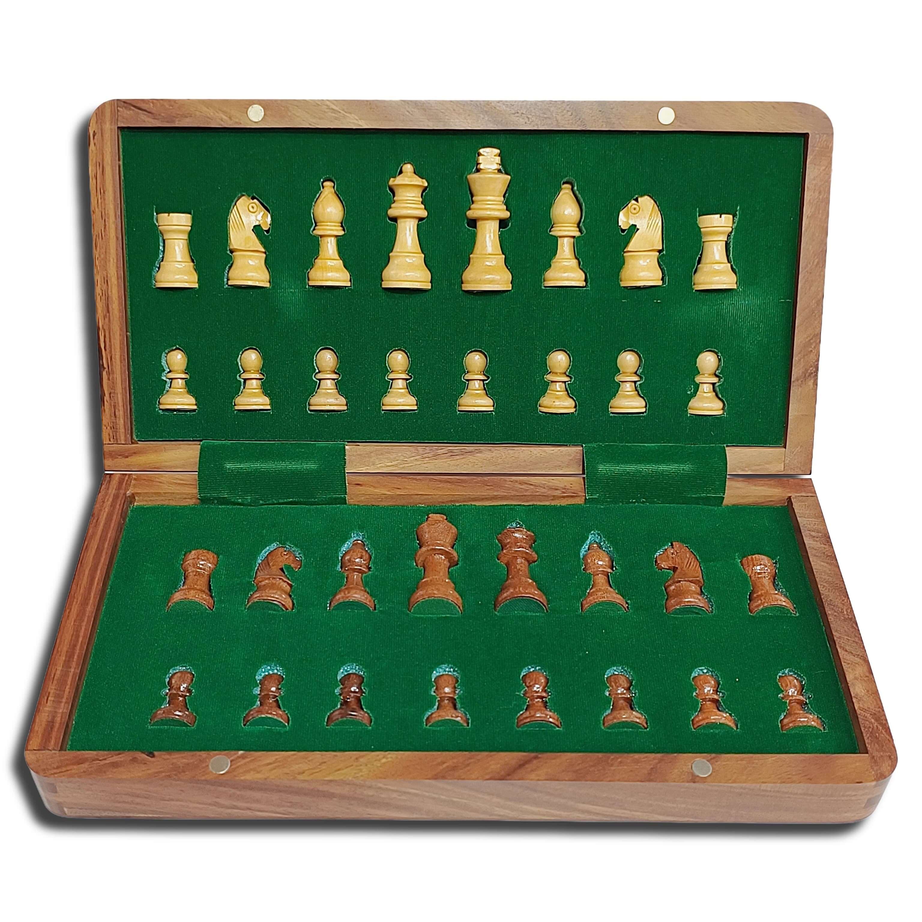 Magnetic travel chess set opened, featuring golden rosewood and maple pieces on green felt interior.