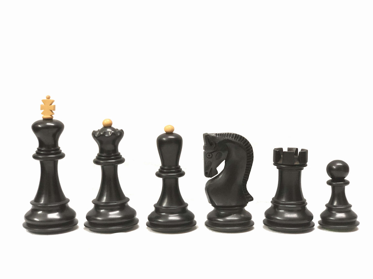 Ebonized chess pieces set featuring king, queen, bishop, knight, rook, and pawn in a luxury design.