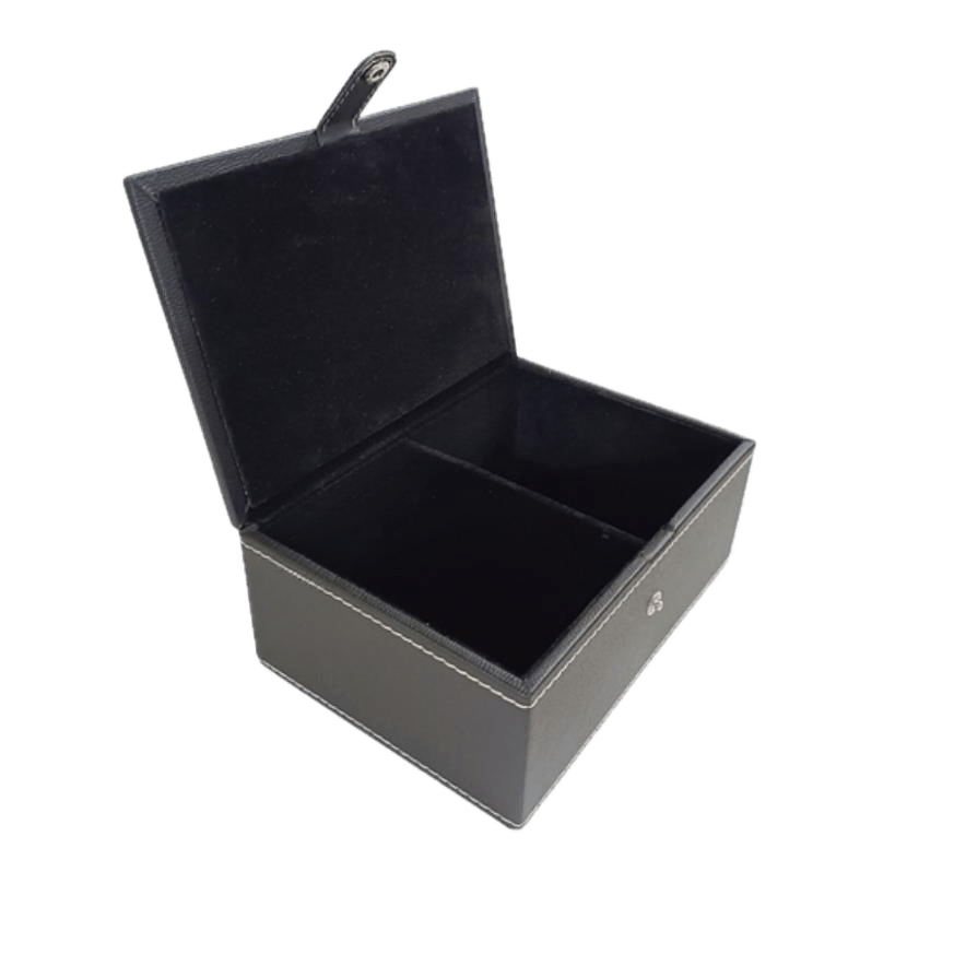 Open black leatherette chess storage box with two compartments and a soft interior lining.