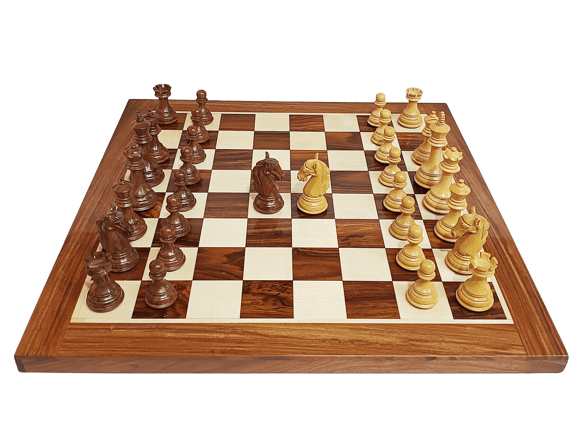 Colombian Staunton chess set on a golden rosewood board featuring boxwood and dark wooden pieces.