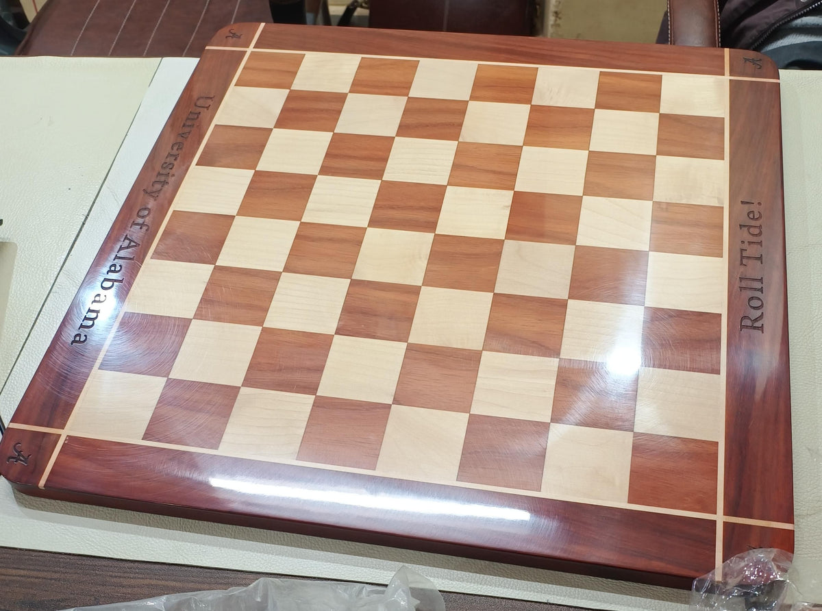 Wooden chessboard made for the University of Alabama with engraved university name, Roll Tide message and A marks on the border