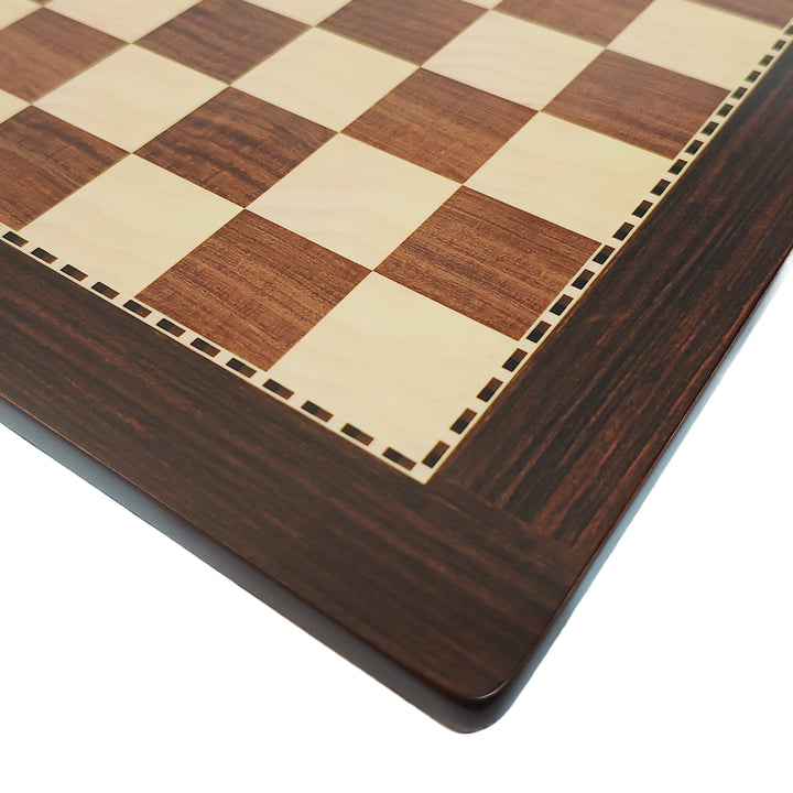 Close-up of a hand crafted wooden chess board with alternating acacia and maple squares.