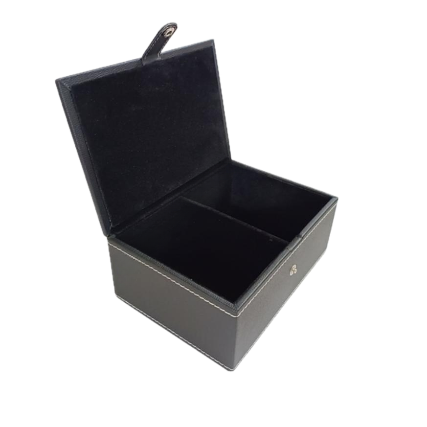 Open black leatherette chess storage box with two compartments and a soft interior lining.