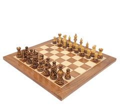 Hand carved burnt Staunton luxury chess set displayed on a professional acacia and boxwood chess board.