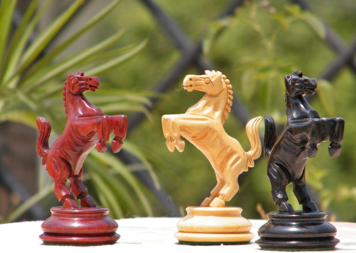 Luxury Ferrari chess pieces in red, ivory, and black showcasing modern design and craftsmanship.