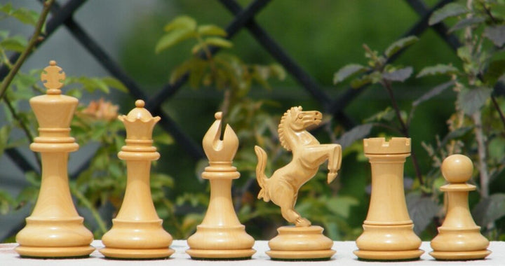 Luxury chess pieces inspired by Ferrari design, showcasing hand-carved craftsmanship in elegant wood finish.