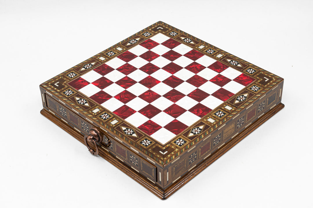 Elegant chess board with a red and white checkered pattern and ornate decorative edges.
