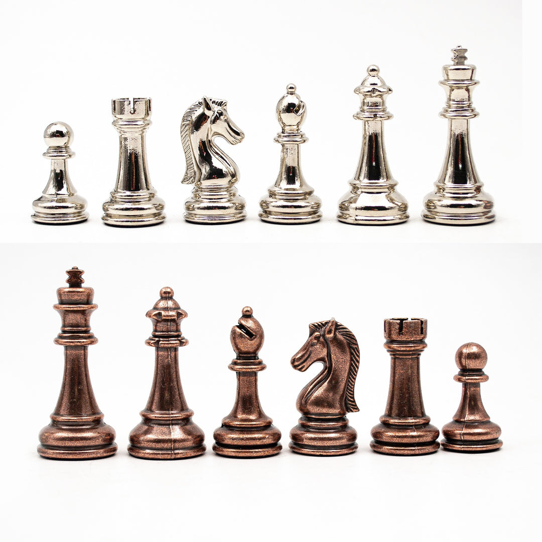 A collection of bronze and silver metal chess pieces, with a focus on the different sizes and designs of the pieces including pawns and a king.