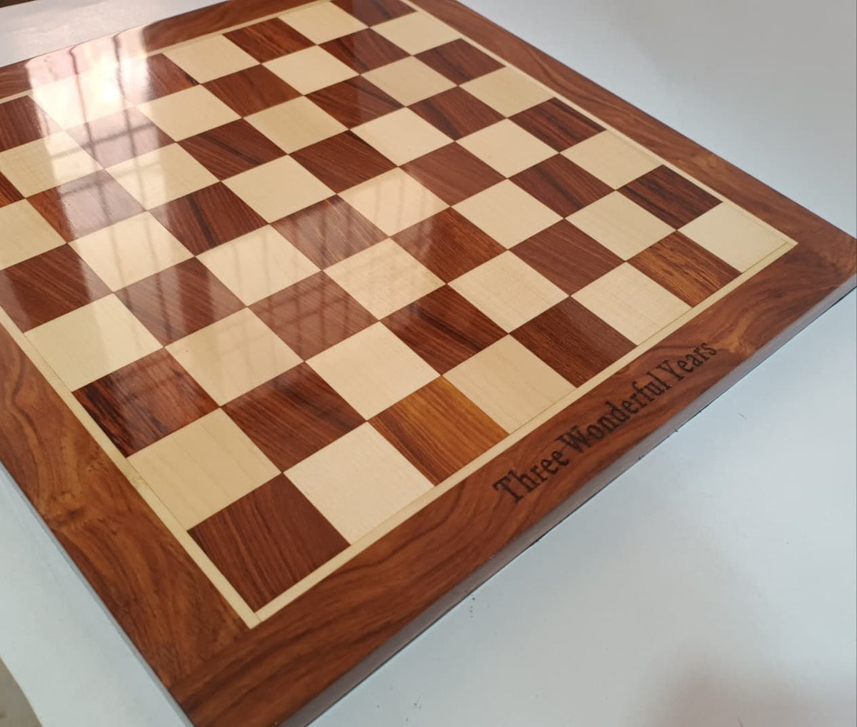 Engraving examples on a wooden chess board